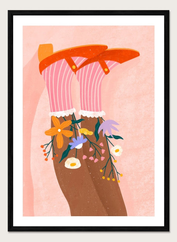 A stylized art print featuring a pair of legs wearing pink striped socks with white ruffles, decorated with colorful wildflowers, and topped with orange high-heeled shoes, set against a textured pink background. Happy Feet and Flowers by Bea Müller premium framed fine art print featuring red Mary Janes, striped socks, and colorful flowers on a soft pink background.