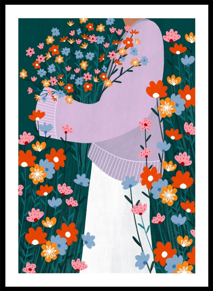 A stylized art print featuring a woman in a lavender sweater and white skirt holding a large bouquet of colorful wildflowers, framed by dense flowers on a dark teal background. Happy Woman Holding Flowers by Bea Müller premium framed fine art print featuring a woman carrying wildflowers in bright orange, pink, blue, and teal.