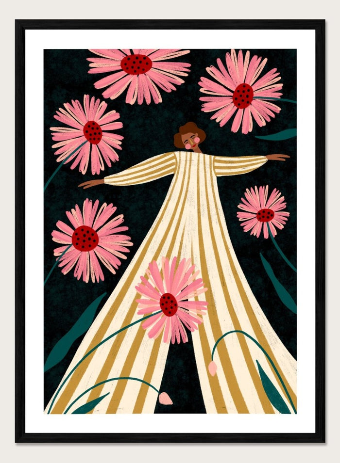 A framed art print featuring a stylized illustration of a woman in a cream and gold striped dress surrounded by large pink flowers on a dark background. Joyful Woman In Bloom by Bea Müller premium framed fine art print featuring a woman in a striped dress surrounded by oversized pink flowers.