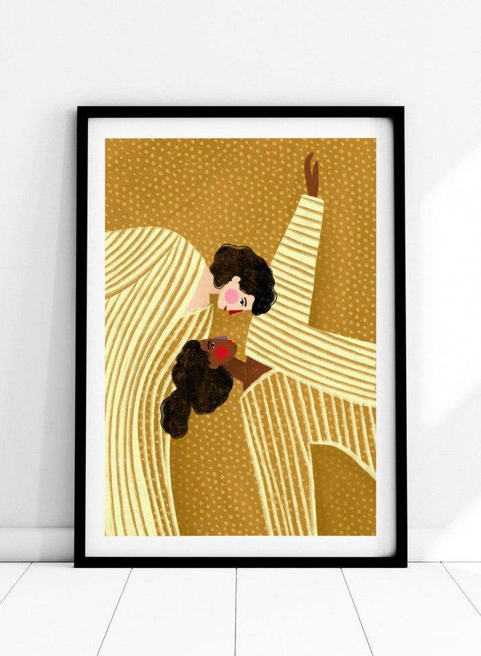 A framed art print featuring a stylized illustration of two women in cream and gold striped dresses against a textured gold background. Loving Embrace by Bea Müller premium fine art print featuring two figures in striped clothing, with warm colors and a bold, intimate composition.