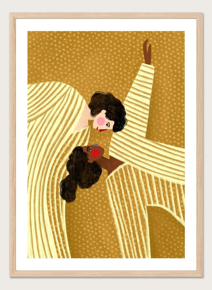 A framed art print featuring a stylized illustration of two women in cream and gold striped dresses against a textured gold background. Loving Embrace by Bea Müller premium fine art print featuring two figures in striped clothing, with warm colors and a bold, intimate composition.