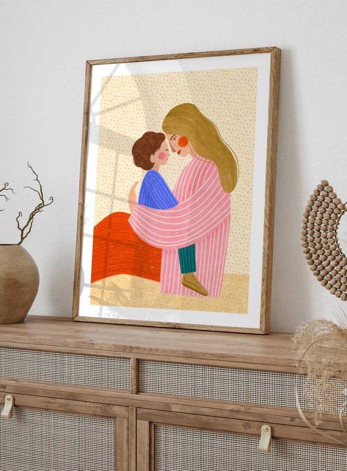 A framed art print featuring a stylized illustration of a woman in a pink striped robe embracing a child in a blue sweater. Loving Mother Child Embrace by Bea Müller premium framed fine art print featuring a mother holding her child close in warm, colorful tones.