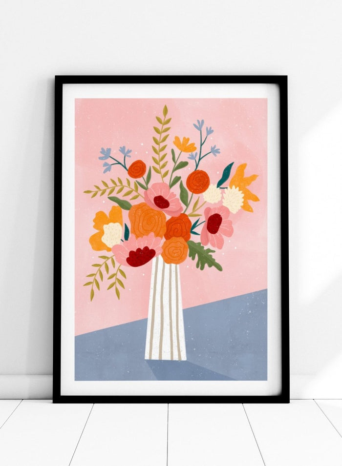 A framed art print featuring a colorful, stylized illustration of a flower bouquet in a striped vase against a pink and blue background. Modern Floral Arrangement by Bea Müller premium framed fine art print featuring a colorful bouquet in a striped vase on a soft pink background.