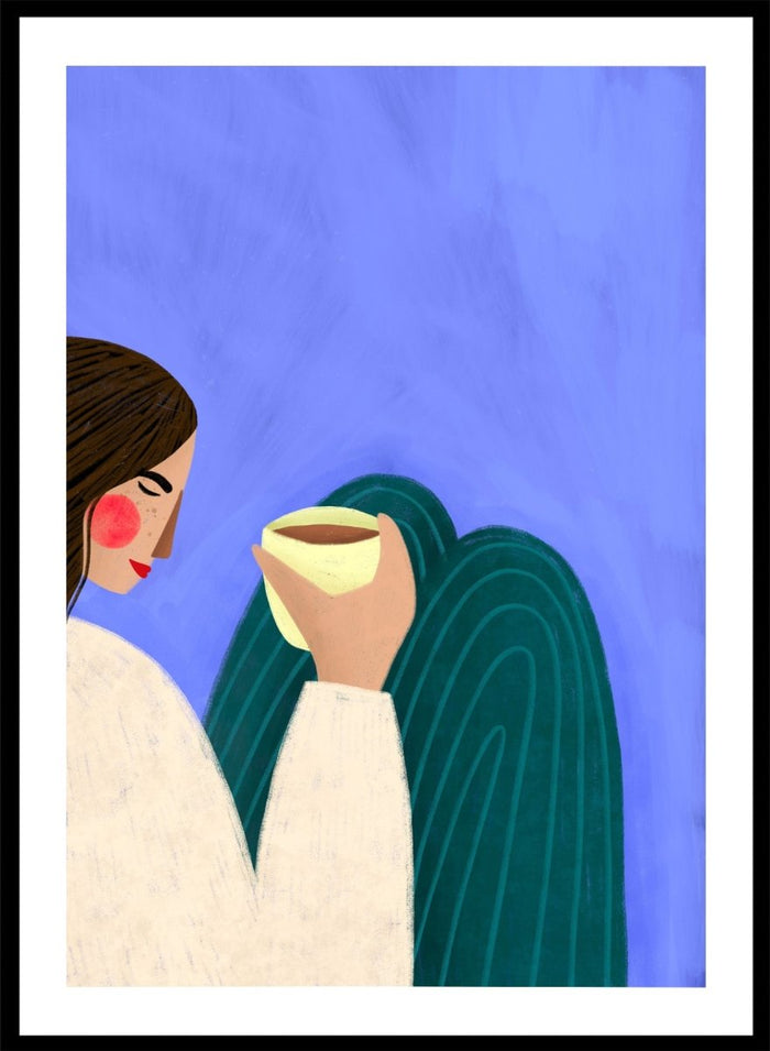 A framed minimalist art print featuring a stylized woman in profile with brown hair, a cream sweater, and a dark teal cape against a textured blue background, holding a pale yellow cup. Peaceful Coffee Moment by Bea Müller premium framed fine art print featuring a woman curled up with a warm drink in soft blue, cream, and teal tones.