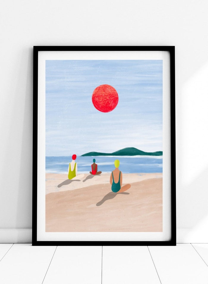A minimalist art print depicting three figures meditating on a sandy beach under a large red sun. Red Sun Beach Serenity by Bea Müller premium fine art print featuring three figures on a beach beneath a bold red sun in a calm coastal setting.