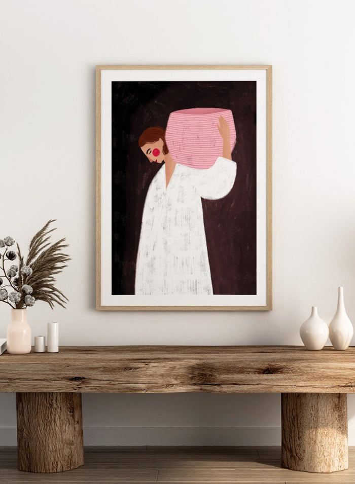 The Woman With the Pink Basket by Bea Müller is an officially licensed art print featuring a modern illustrated figure with soft color contrast and a calm, grounded feel. Available framed or unframed.