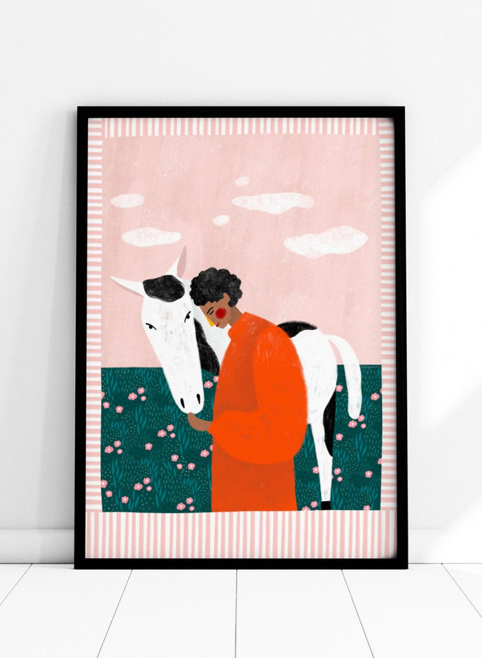 Illustration of a person in an orange outfit hugging a white horse against a pink background with clouds. Vibrant Girl and Horse by Bea Müller is a colorful girl and horse art print featuring modern expressive illustration. Officially licensed wall poster with optional framing.