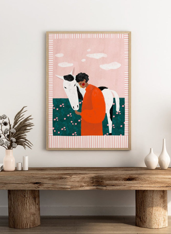 Illustration of a person in an orange outfit hugging a white horse against a pink background with clouds. Vibrant Girl and Horse by Bea Müller is a colorful girl and horse art print featuring modern expressive illustration. Officially licensed wall poster with optional framing.