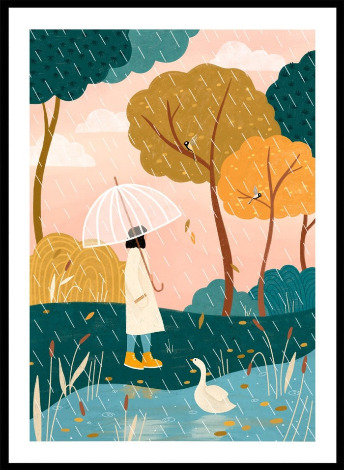 A framed art print featuring a whimsical illustration of a person holding a clear umbrella in the rain near a pond with a white goose, surrounded by stylized trees in teal, mustard, and orange tones. Walking In Autumn Rain by Bea Müller premium framed fine art print featuring a woman with an umbrella beside a pond in a colorful rainy landscape.