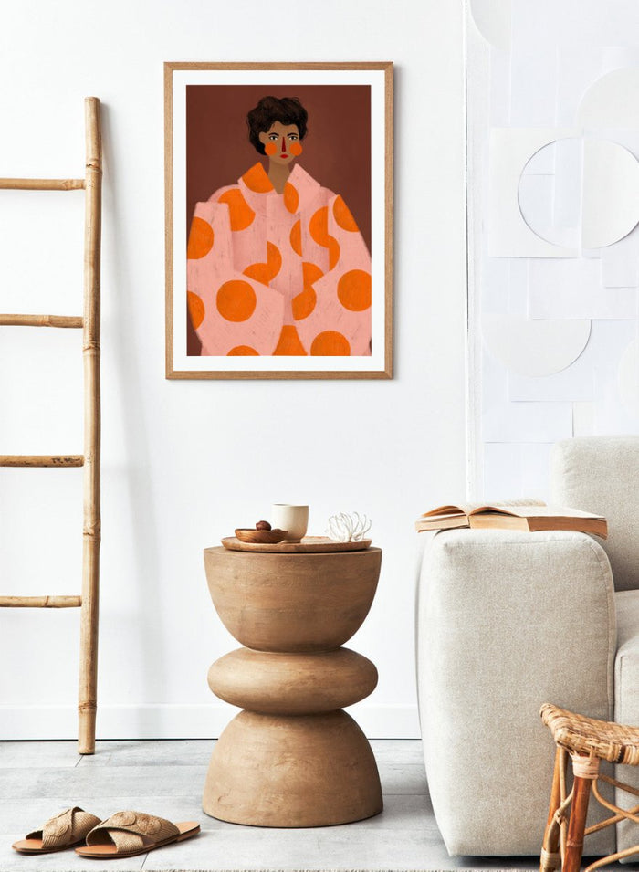 Woman With Orange Dots by Bea Müller is an officially licensed art print featuring a bold modern portrait with graphic color and pattern. Available framed or unframed.