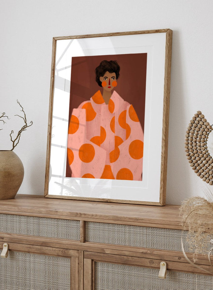 Woman With Orange Dots by Bea Müller is an officially licensed art print featuring a bold modern portrait with graphic color and pattern. Available framed or unframed.