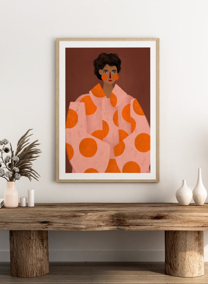 Woman With Orange Dots by Bea Müller is an officially licensed art print featuring a bold modern portrait with graphic color and pattern. Available framed or unframed.