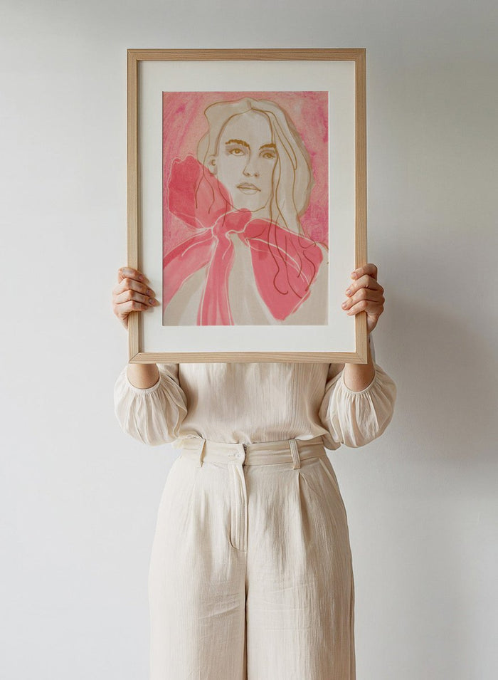 Artistic illustration of a woman with a pink bow tie on a pink background. Ethereal Red by Beate Tubach is a modern portrait art print featuring expressive linework and flowing red tones. A contemporary figurative wall poster.