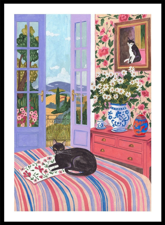 Cat lounging on a striped bed with a view of a garden through open doors, surrounded by flowers and decorative items. Black Cat on Bed French Doors Garden View by Caroline Bonne Müller is a colorful interior art print featuring cat illustration, floral room, and scenic garden view in a modern aesthetic style.