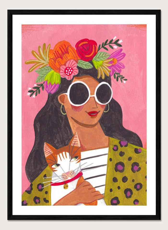 Illustration of a woman with a floral headpiece and sunglasses on a pink background. Cat Lady by Caroline Bonne Müller is a fine art print and wall poster of a woman holding a cat with bold color, floral crown, and modern aesthetic style.
