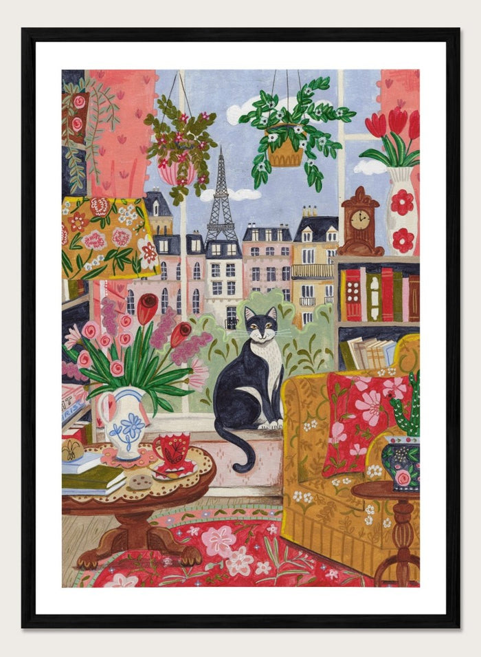 Colorful illustration of a living room with a cat, flowers, and a cityscape. Cozy Parisian Window Cat by Caroline Bonne Müller is a fine art print and wall poster of a cat by a window with Paris view and colorful interior.