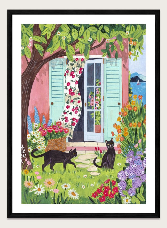 Garden Cats by the Sea by Caroline Bonne Müller is a colorful coastal garden art print featuring cats, florals, and seaside home in a modern aesthetic illustration style.