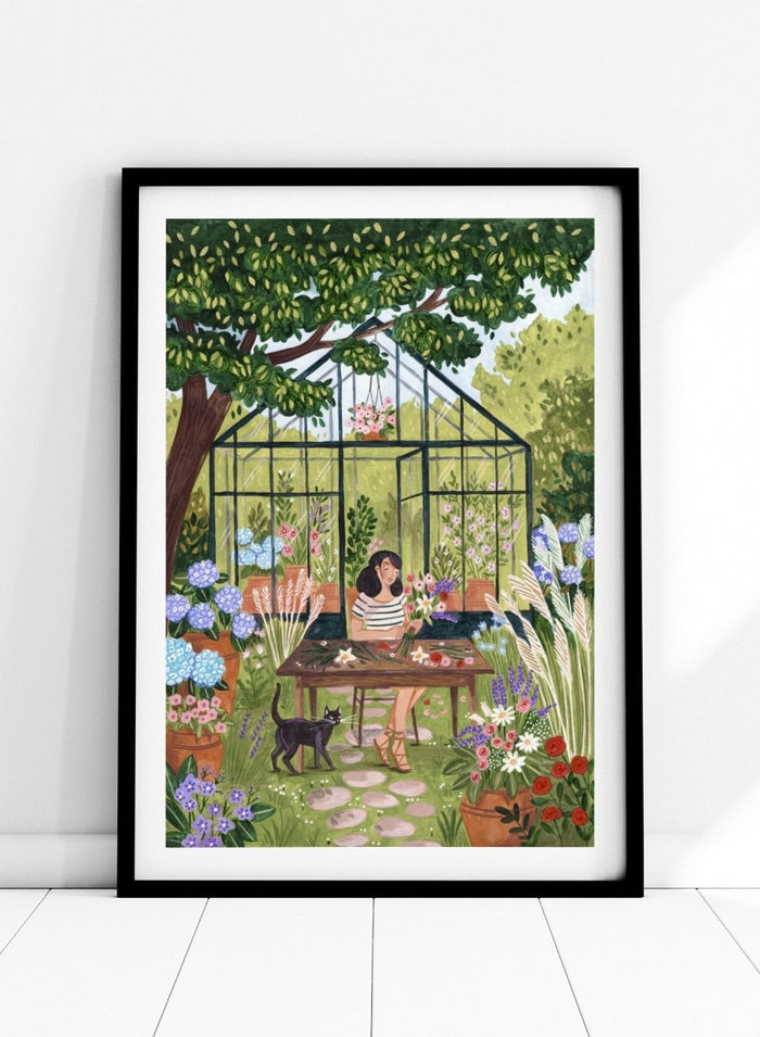 Garden Flower Arranging by Caroline Bonne Müller is a floral garden art print featuring greenhouse, woman arranging flowers, cat illustration, and modern aesthetic botanical scene.