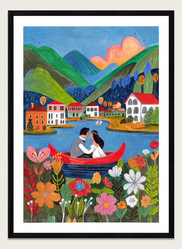 Couple in a red boat on a lake with mountains and houses in the background, surrounded by colorful flowers. Just Married Couple in a Boat by Caroline Bonne Müller is a romantic art print featuring couple illustration, lake scene, colorful flowers, and modern aesthetic wedding artwork.