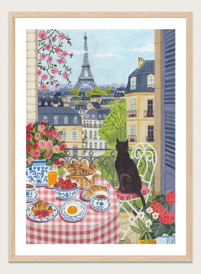 Parisian scene with a cat, table setting, and Eiffel Tower view. Paris Balcony Breakfast by Caroline Bonne Müller is a colorful Paris art print featuring Eiffel Tower view, breakfast table, cat illustration, and modern aesthetic city scene.