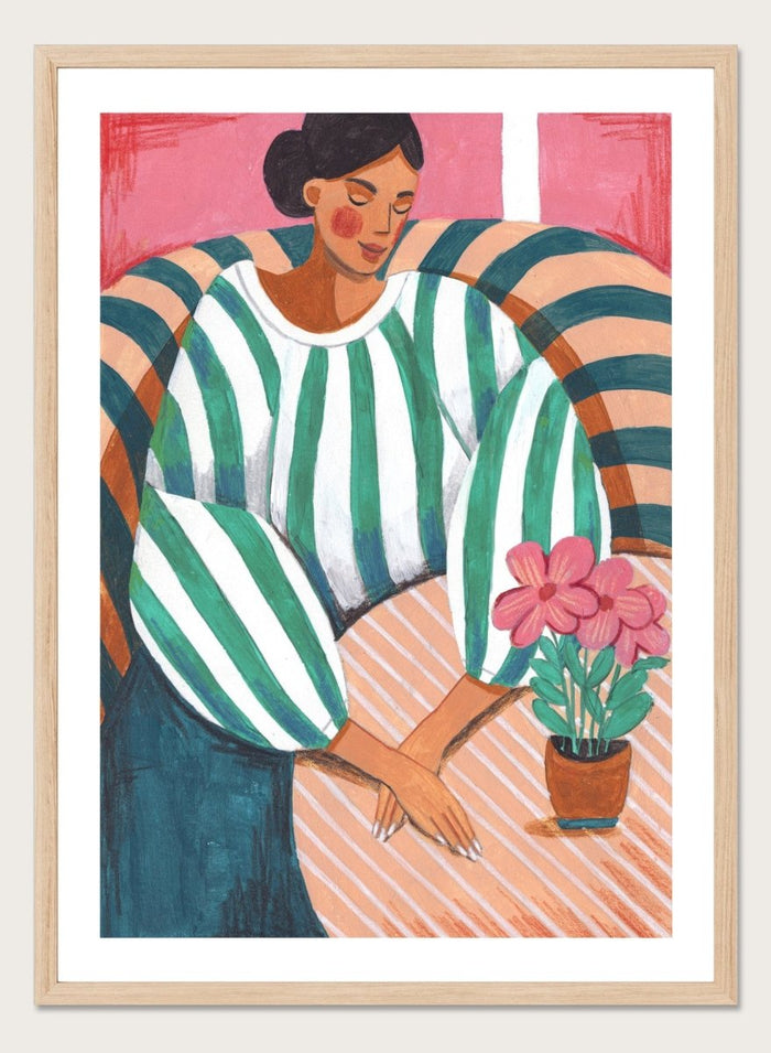 Artistic illustration of a person holding a potted plant with a colorful background. Peaceful Woman Home by Caroline Bonne Müller is a fine art print and wall poster of a woman seated indoors with flowers and striped patterns.