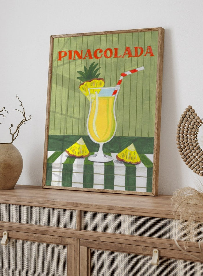 Illustration of a pina colada drink with pineapple slices on a checkered tablecloth. Piña Colada Summer Drink by Caroline Bonne Müller is a fine art print and wall poster of a pineapple cocktail with striped straw and green table setting.