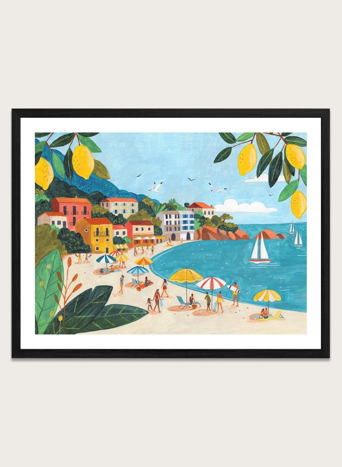Framed artwork of a beach scene with people, umbrellas, and sailboats. Sunny Lemon Coastal Town by Caroline Bonne Müller is a colorful coastal art print featuring beach scene, seaside town, lemon branches, and modern aesthetic summer illustration.