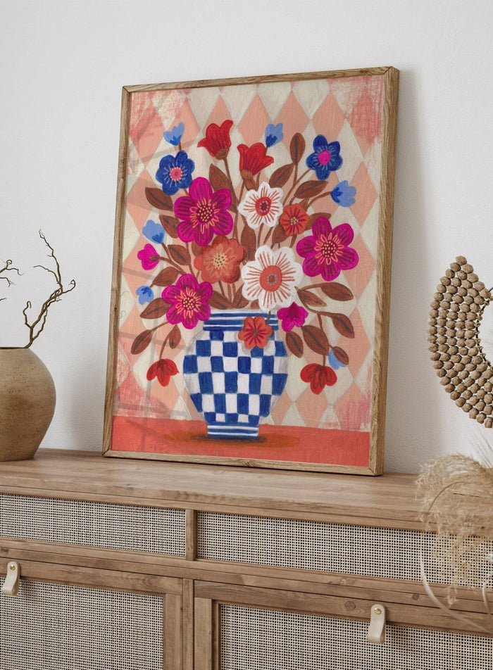 Decorative quilt with a blue and white checkered vase and colorful flowers on a patterned background. Vibrant Checked Vase Flowers by Caroline Bonne Müller is a fine art print and wall poster featuring colorful flowers in a blue checkered vase.