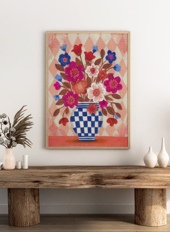 Decorative quilt with a blue and white checkered vase and colorful flowers on a patterned background. Vibrant Checked Vase Flowers by Caroline Bonne Müller is a fine art print and wall poster featuring colorful flowers in a blue checkered vase.