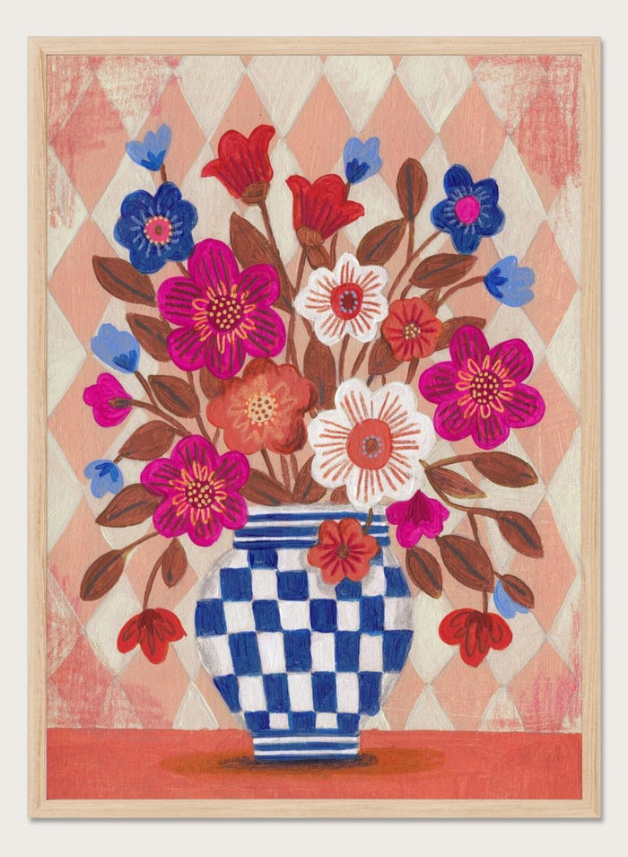 Decorative quilt with a blue and white checkered vase and colorful flowers on a patterned background. Vibrant Checked Vase Flowers by Caroline Bonne Müller is a fine art print and wall poster featuring colorful flowers in a blue checkered vase.