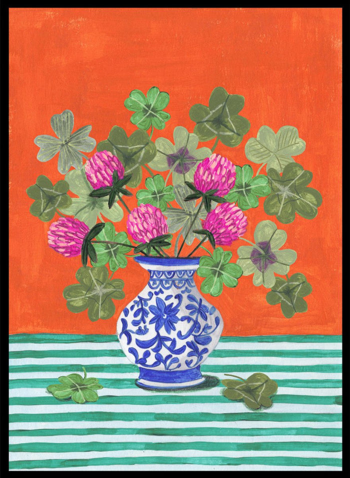 Vase with pink flowers and green leaves on a red and green striped background. Vibrant Clover Still Life by Caroline Bonne Müller is a fine art print and wall poster featuring clover leaves, pink flowers, and a blue vase on a striped table.