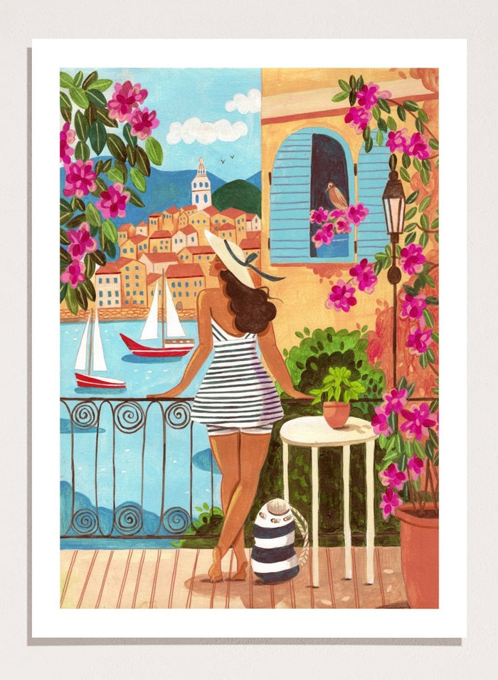 Woman on a balcony overlooking a coastal town with boats and flowers. Woman Balcony Coastal View by Caroline Bonne Müller is a fine art print and wall poster of a woman overlooking a coastal town with boats in a modern aesthetic style.