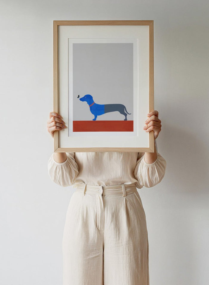 Blue dachshund wall art print by Casa Cartissi featuring a modern butterfly illustration. Contemporary minimalist animal fine art poster with textured shapes and warm color palette.