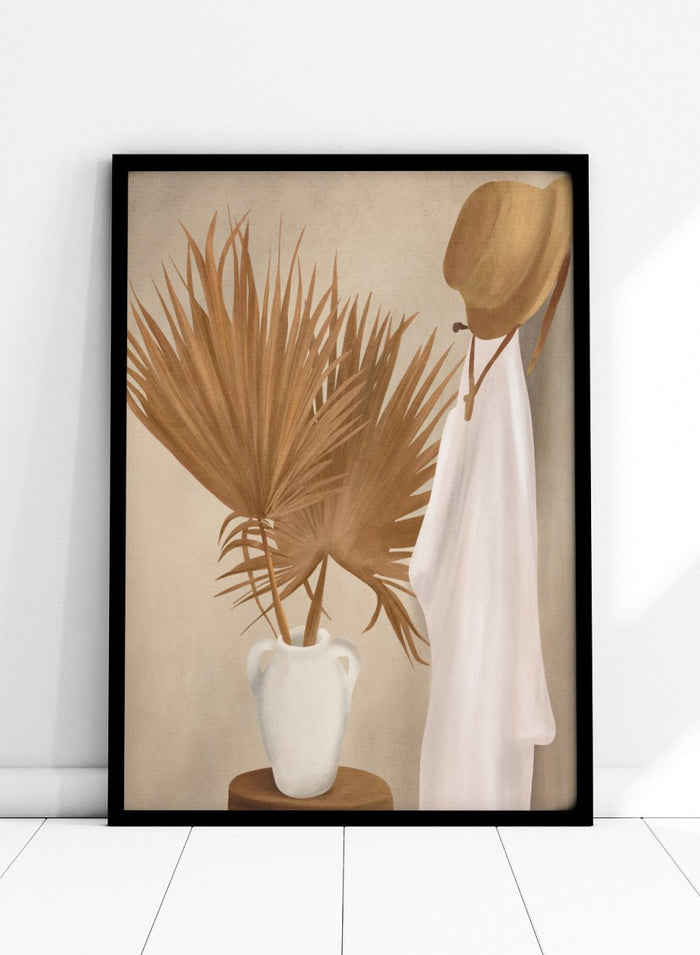 White vase with dried palm leaves and a white garment on a beige background. Boho Palm Summer Vibes by City Art is a neutral boho art print with dried palm leaves, a white summer dress, a straw hat, and warm organic textures.