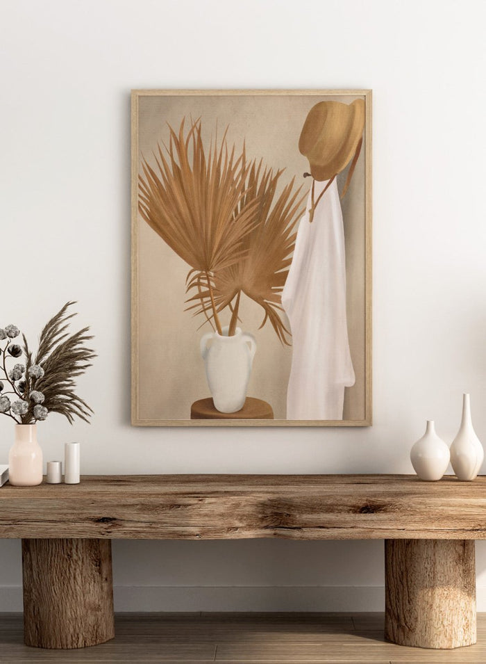 White vase with dried palm leaves and a white garment on a beige background. Boho Palm Summer Vibes by City Art is a neutral boho art print with dried palm leaves, a white summer dress, a straw hat, and warm organic textures.