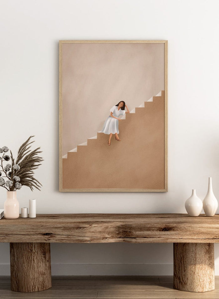 Woman in a white dress walking up a set of stairs with a beige wall and floor. Calm Woman Staircase by City Art is a minimalist figurative art print featuring a woman seated on a staircase with soft neutral tones and modern architectural style.