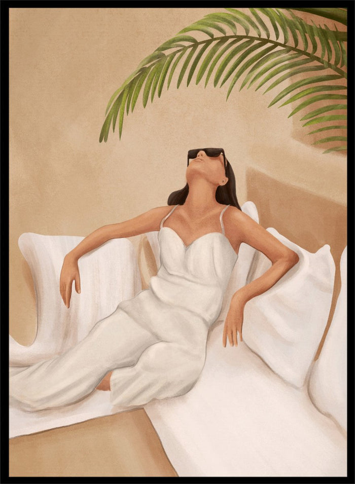 Woman in a white dress lying on a couch with a palm leaf above, against a beige wall. Chic Summer Serenity by City Art features a woman reclining among cushions and palm leaves, bringing warm summer tones and relaxed interiors to your home.