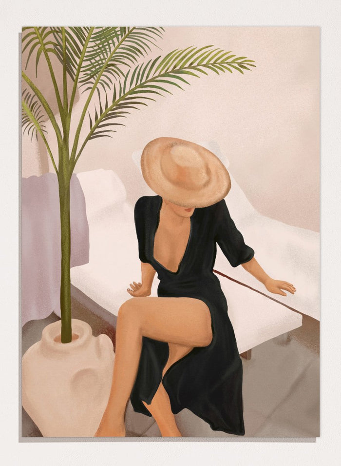 Woman in a black dress and straw hat sitting on a white chair with a plant nearby. Elegant Woman Sun Hat by City Art is a modern figurative art print featuring a stylish woman, tropical greenery, warm neutrals, and relaxed summer living.