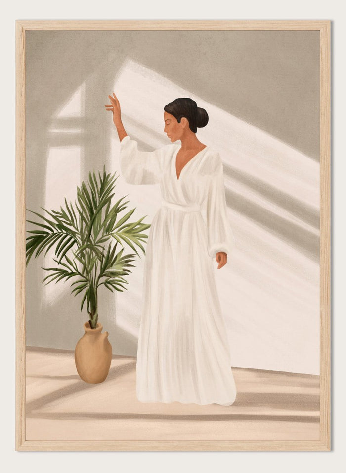 Woman in a white dress standing in a softly lit room with a plant. Elegant Woman Warm Light by City Art is a modern figurative art print featuring a woman in white, golden sunlight, tropical greenery, and warm neutral tones.