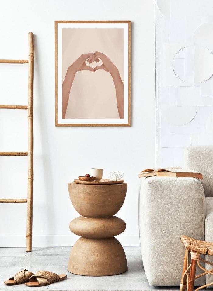 Framed artwork of hands making a heart shape on a beige background. Heartfelt Hands by City Art is a modern figurative art print featuring hands forming a heart. A love-inspired wall poster from the It’s All Love collection.