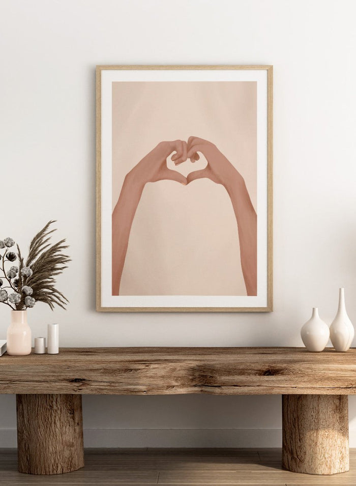 Framed artwork of hands making a heart shape on a beige background. Heartfelt Hands by City Art is a modern figurative art print featuring hands forming a heart. A love-inspired wall poster from the It’s All Love collection.