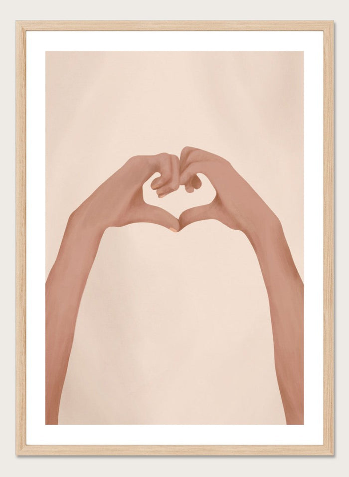 Framed artwork of hands making a heart shape on a beige background. Heartfelt Hands by City Art is a modern figurative art print featuring hands forming a heart. A love-inspired wall poster from the It’s All Love collection.