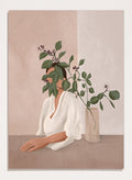 Artistic depiction of a woman with green leaves covering her face, sitting next to a vase on a table. Serene Botanical Woman by City Art features a woman surrounded by greenery, bringing soft botanical style and modern neutral wall art to your home.