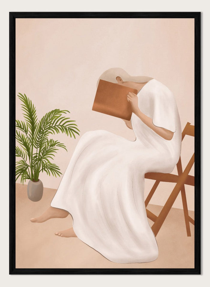 Person in a white dress holding a book, sitting on a chair with a plant nearby. Serene Woman Reading by City Art is a minimalist figurative art print featuring a woman reading in a flowing white dress with warm neutral tones and botanical details.