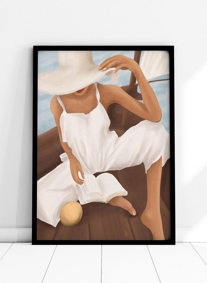 Woman in a white dress and hat reading a book on a boat. Summer Boat Reading by City Art is a modern coastal art print featuring a woman reading on a boat in a white dress, surrounded by blue water and warm wood.