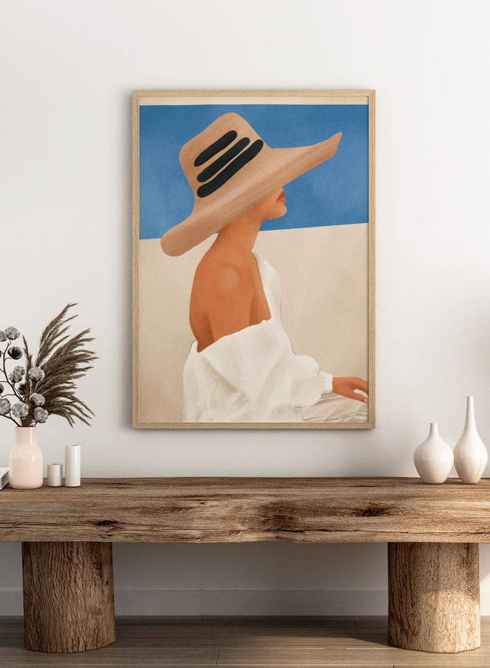 Woman wearing a large straw hat with black bands against a blue sky. Summer Hat Profile by City Art features a woman beneath a straw sun hat against a blue sky, bringing coastal style and summer-inspired portrait art into the home.