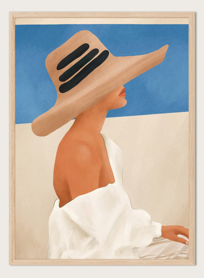 Woman wearing a large straw hat with black bands against a blue sky. Summer Hat Profile by City Art features a woman beneath a straw sun hat against a blue sky, bringing coastal style and summer-inspired portrait art into the home.