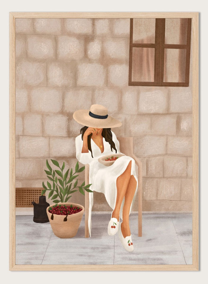 Illustration of a woman sitting on a chair with a plant and bowl of fruit in a stone-walled room. Woman with Cherries on Patio by City Art is a modern summer art print featuring a woman in white, fresh cherries, a sun hat, and warm patio style.