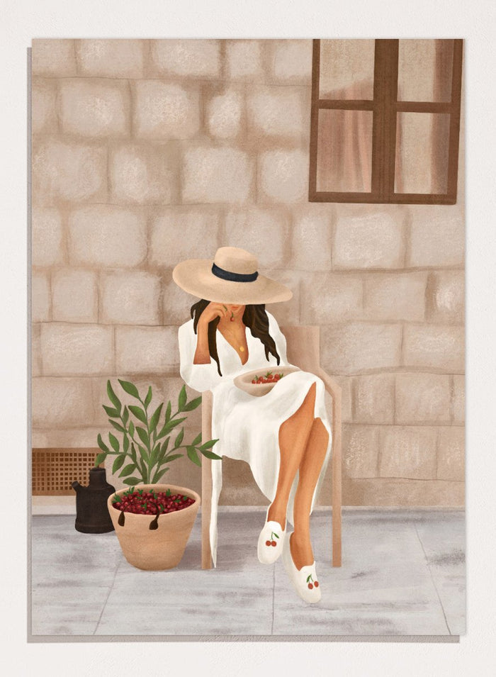 Illustration of a woman sitting on a chair with a plant and bowl of fruit in a stone-walled room. Woman with Cherries on Patio by City Art is a modern summer art print featuring a woman in white, fresh cherries, a sun hat, and warm patio style.