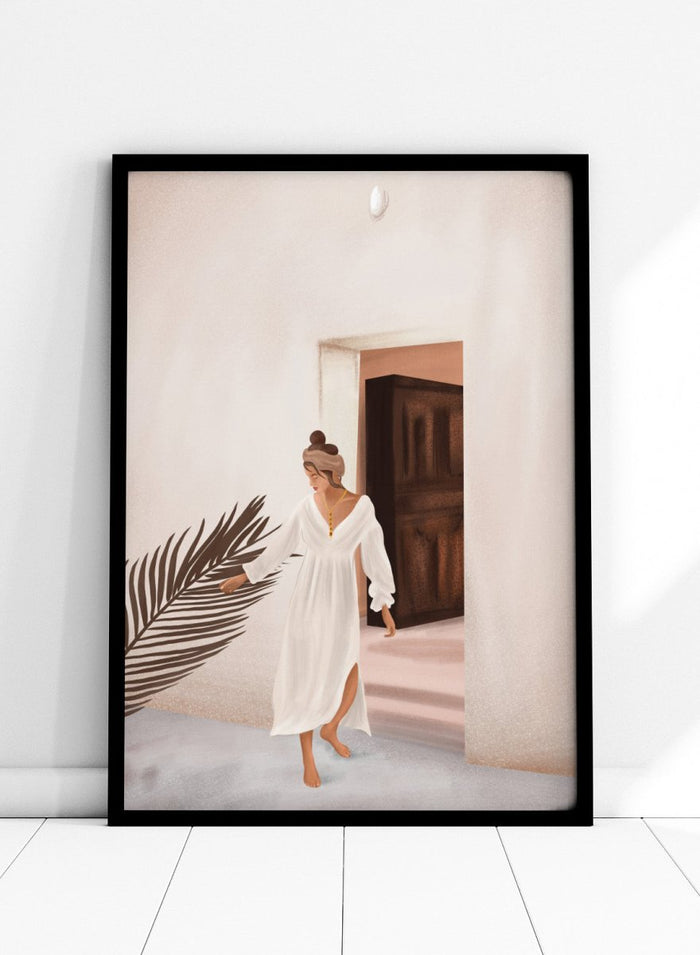 Woman in a white dress standing in a doorway with a palm leaf in the foreground. Woman With Palm Leaf by City Art is a modern figurative art print featuring a woman in a white dress, tropical greenery, warm neutrals, and Mediterranean style.